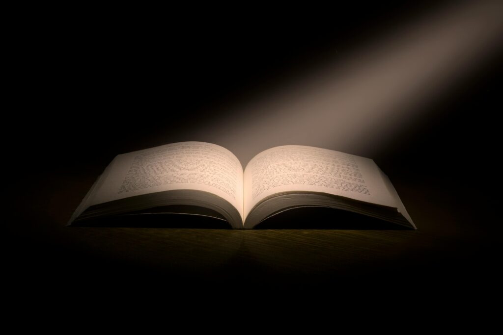 pexels-photo-1029141-1029141 A captivating image of an open book under a dramatic spotlight, symbolizing knowledge.